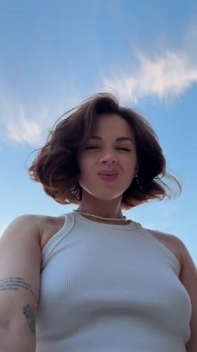 Woman records sunset selfies in Sarapul amid dramatic skies