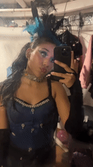Theatrical performers prepare backstage, perform choreographed show in Porlamar