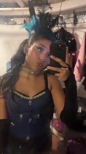 Theatrical performers prepare backstage, perform choreographed show in Porlamar