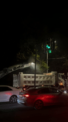 Nighttime road construction and traffic activity documented in Yerevan
