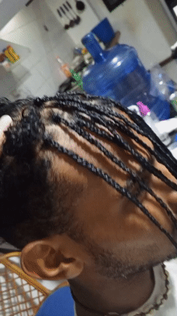 Hair braiding and makeup palette documented in Porlamar