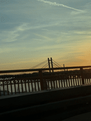 Belgrade sunset illuminates skyline and waterfront in golden light
