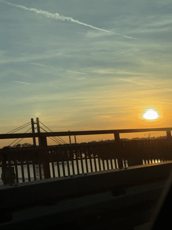 Belgrade sunset illuminates skyline and waterfront in golden light