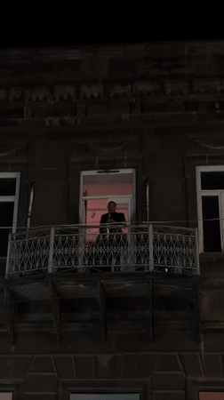 Saxophonist performs evening balcony concert in Gyumri, Armenia