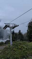 Riding the Tufandag gondola through misty Caucasus mountain fog