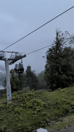 Riding the Tufandag gondola through misty Caucasus mountain fog