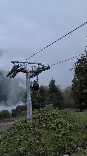 Riding the Tufandag gondola through misty Caucasus mountain fog