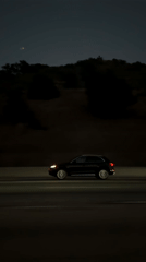 SUV travels Los Angeles highway at night