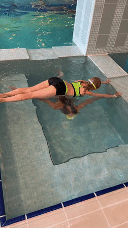 Children practice swimming in indoor pool in Serik, Turkey