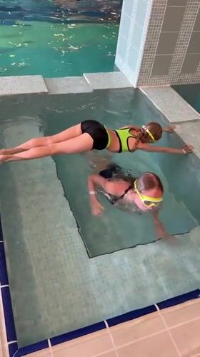 Children practice swimming in indoor pool in Serik, Turkey