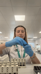 Lab worker extracts liquid samples in Moscow laboratory
