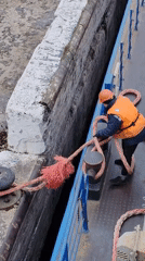 Vessel docking operations captured at Russian river facility