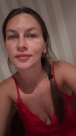 Woman takes multiple selfies in Fredenbeck bedroom