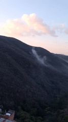 Foggy mountain vista captured in evening Caracas