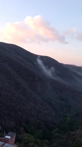 Foggy mountain vista captured in evening Caracas