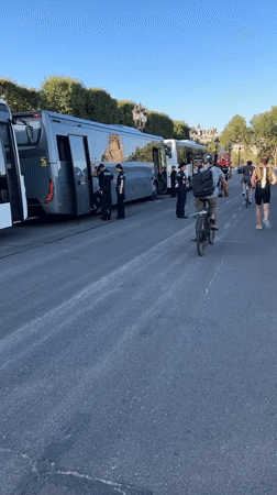 Police presence and public art spotted in early-morning Paris