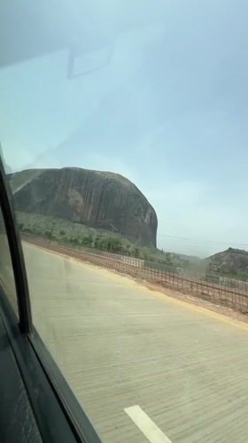 Zuma Rock documented from roadside perspectives in Nigeria