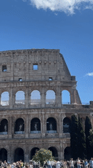 Tourists gather at Rome's Colosseum on sunny May morning