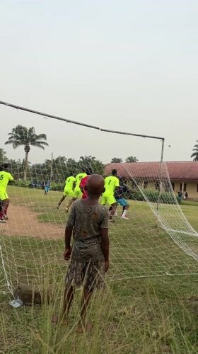 Children gather for informal soccer in Ikot Ekpene, Nigeria