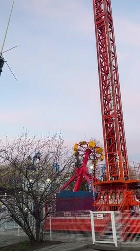 Evening crowds enjoy amusement park activities in Tyumen, Russia