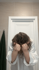 Woman grooming, artist mixing paint observed in Moscow bathroom