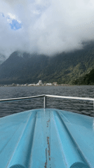 Boat journey across lake near Baturiti captures mountain town
