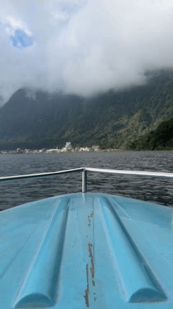 Boat journey across lake near Baturiti captures mountain town