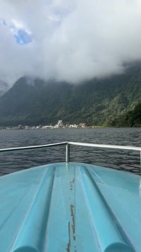 Boat journey across lake near Baturiti captures mountain town