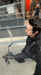 Young man spotted cycling and taking selfie in Paris