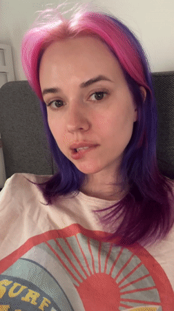 Young person poses in pink accessories in Zagreb park