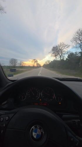 Dashboard cam captures sunset drive on rural Bulgarian road