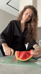 Watermelon in the kitchen, golden spire and building sculpture outside