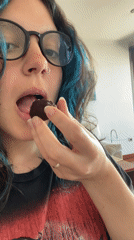 Person enjoys stuffed date treat in Gijón workspace