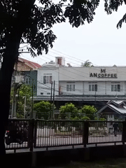 Everyday street life along a Lhokseumawe sidewalk