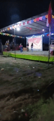 Outdoor community night event with performances in Margo Rukun, Indonesia