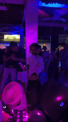 DJ performs to dancing crowds at Thailand nightclub