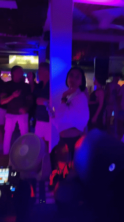 DJ performs to dancing crowds at Thailand nightclub