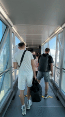 Passengers board SKYTEA aircraft during early morning departure