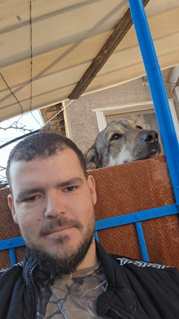 Dog photobombs man's selfie on bench in Bulgaria