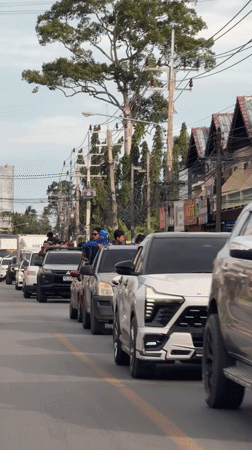Pickup truck convoy rolls through Ko Samui streets