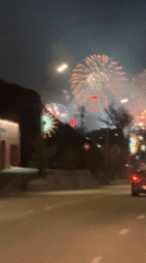 Fireworks Display Observed Over Decorated Street in Krasnoyarsk
