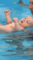 Baby swimming lesson documented at Moscow aquatic center