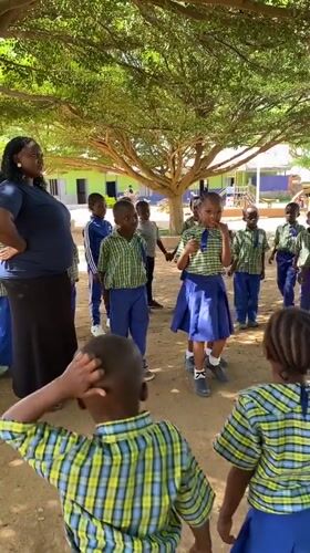School children gather under tree in Gura Top, Nigeria