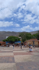 Afternoon tourism and commerce around Altagracia cathedral plaza