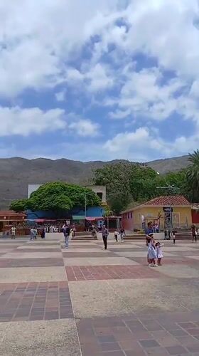 Afternoon tourism and commerce around Altagracia cathedral plaza