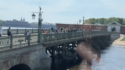 Morning life unfolds across Saint Petersburg's bridges and riverbanks