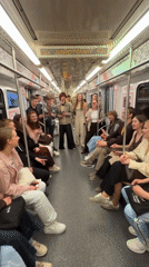 Young adults perform impromptu song on crowded Moscow subway