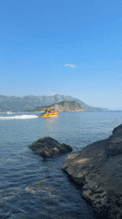 Tourist explores Budva's historic sites and coastal areas