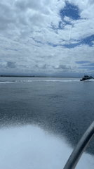 Motorboat travels choppy Indonesian waters with passengers aboard