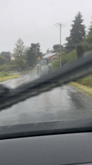 Tractor spotted on wet road in Chambœuf during morning commute